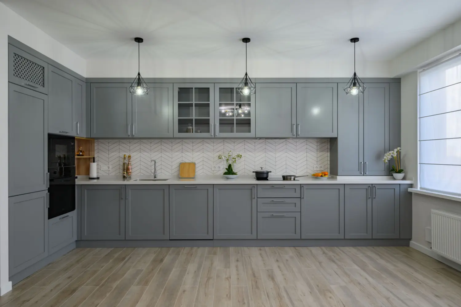 Savannah cabinet resurfacing experts transforming kitchen cabinets with a sleek gray finish.